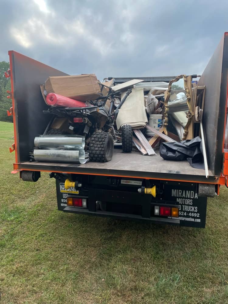 fully loaded bed of junk removal truck leaving site in Conshohocken PA