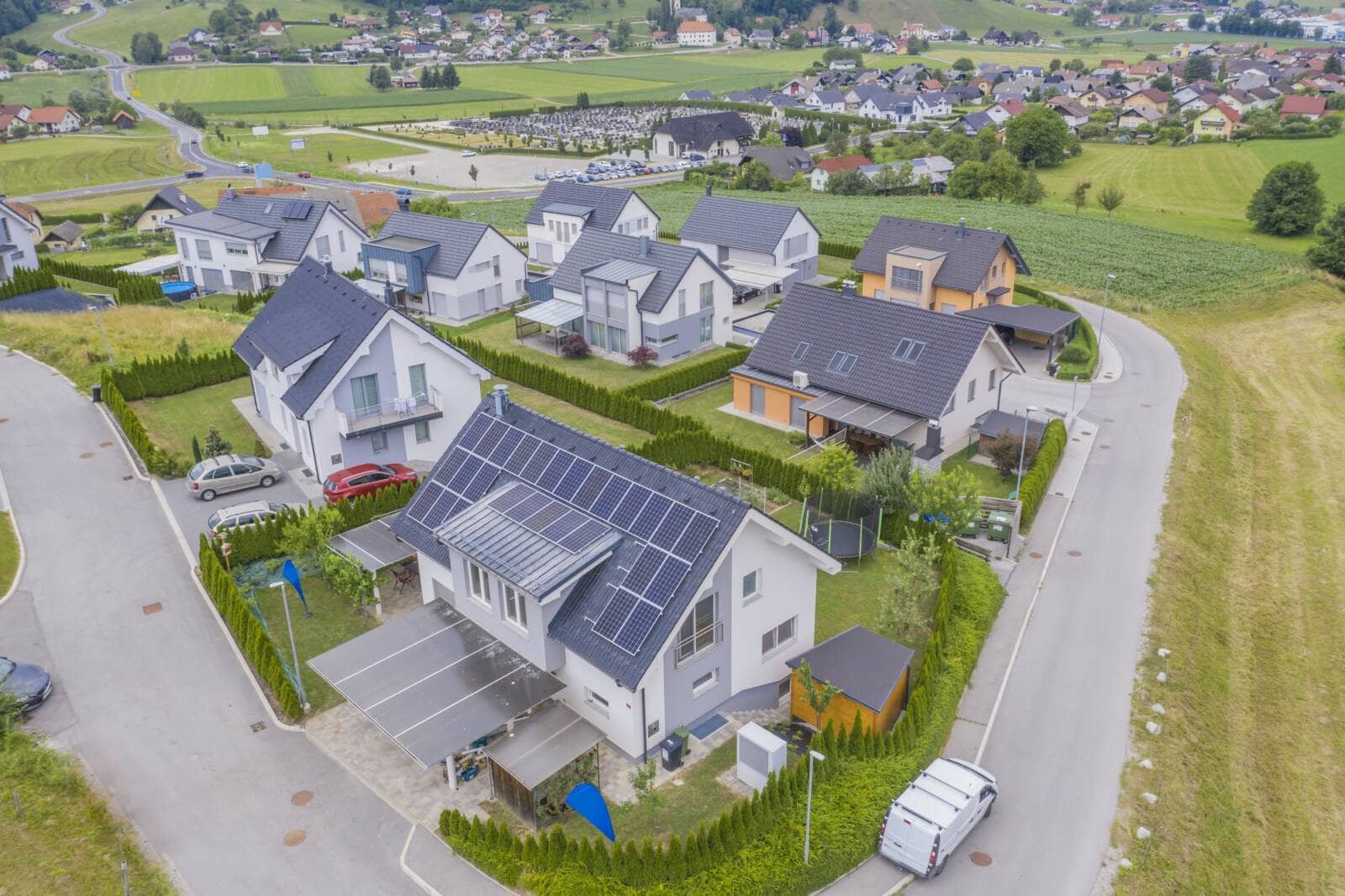 High angle shot of private houses with solar panels on the roofs A high angle shot of private houses with solar panels on the roofs