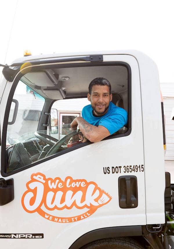 burlington-nj-junk-removal happy driver in truck leaving junk removal burlington NJ jobsite
