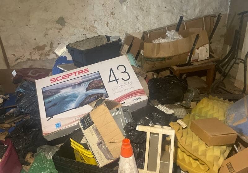 basement in camden nj full of junk before removal