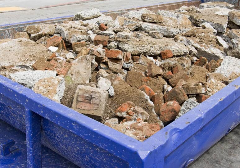 bin filled with broken up concrete slabs
