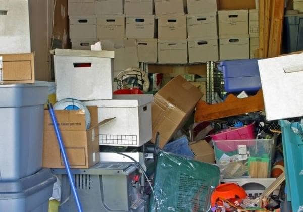 cluttered garage full of boxes needing garage clean out service