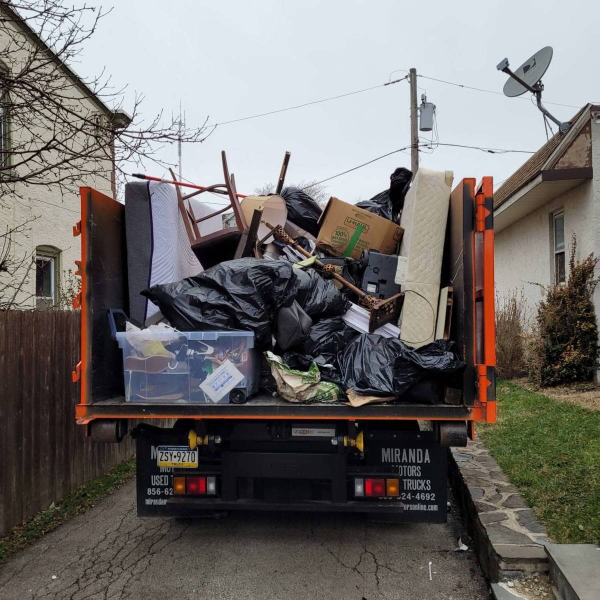 trash-mattress-and-other-junks-loaded-to-we-love-junk-truck